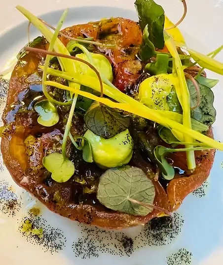 Farm-to-table gourmet tart with microgreens and edible flowers, wellness cuisine in France