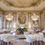 Le Meurice Michelin star restaurant gilded dining room with crystal chandeliers and painted ceiling, luxury Paris, France