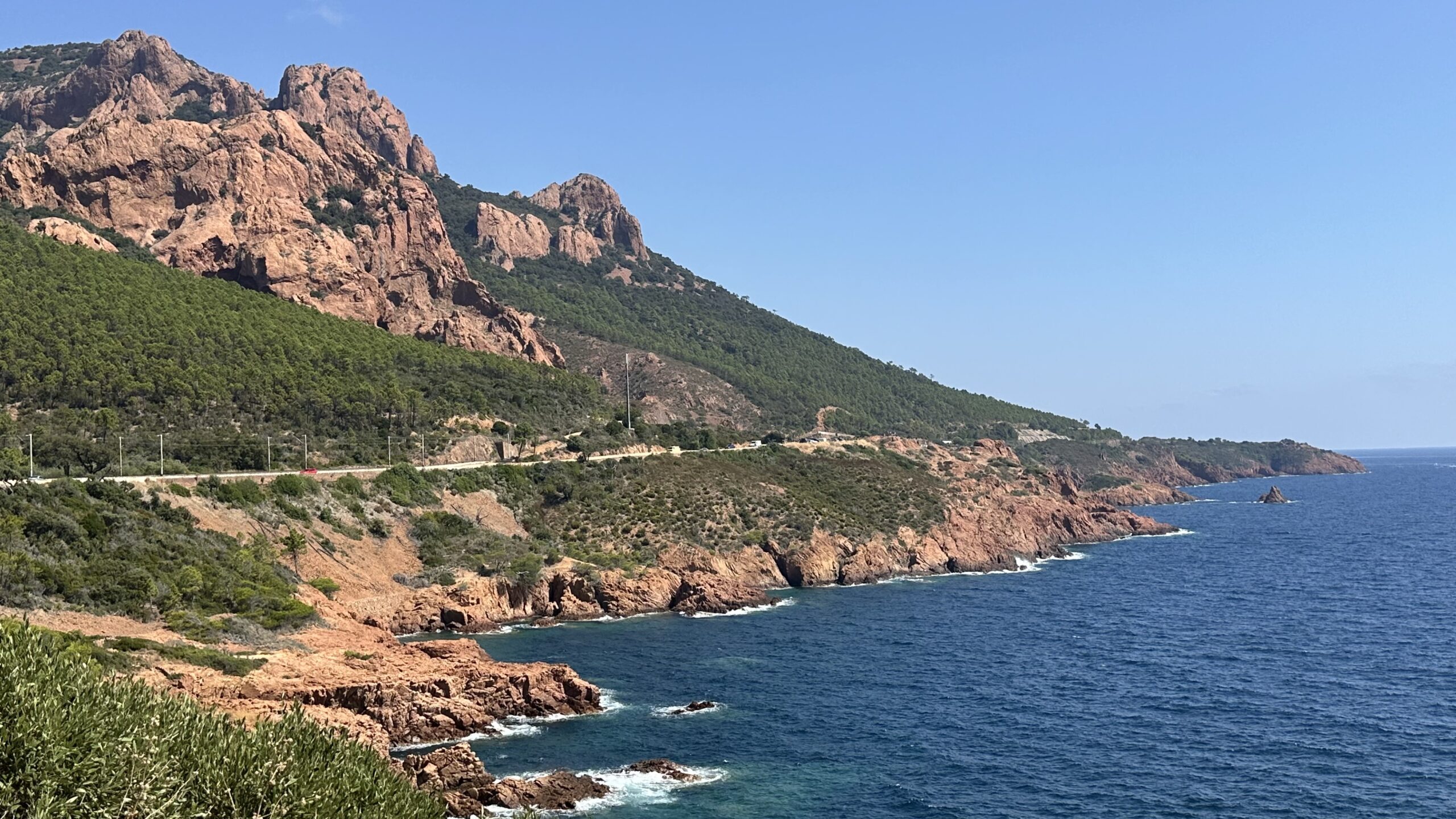 Esterel Massif red volcanic rocks and coastal road above deep blue Mediterranean on a luxury French Riviera tour, France