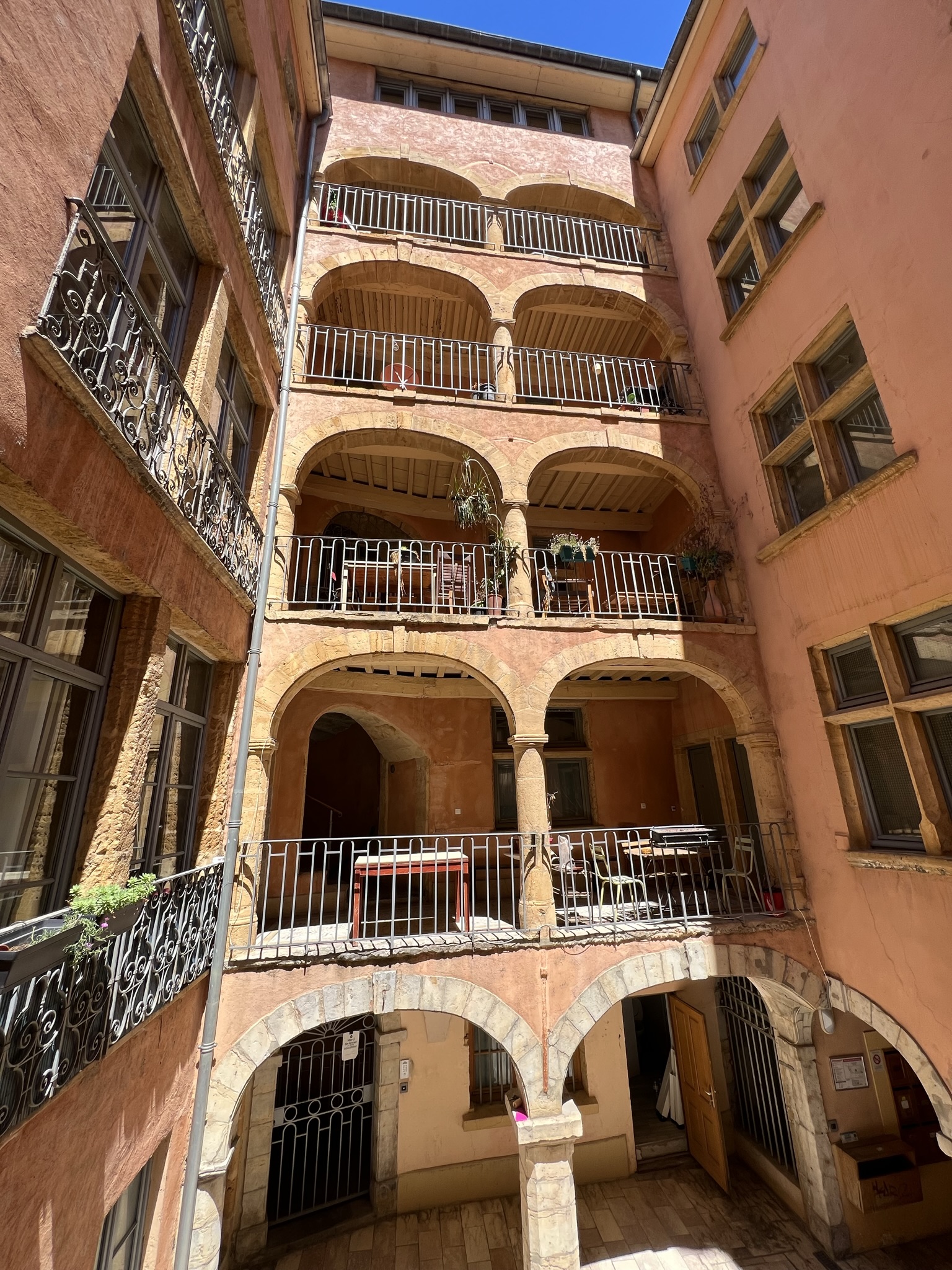 Lyon Vieux-Lyon Renaissance traboule courtyard with arched stone galleries and balconies, Rhône Valley, France